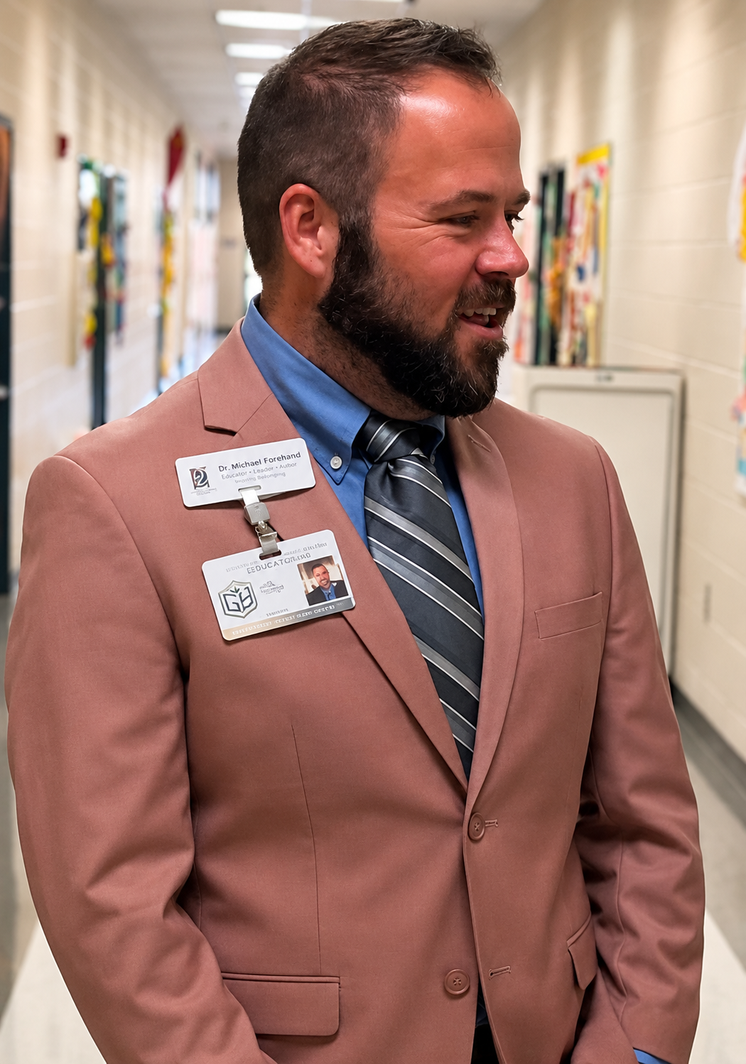 Dr. Michael Forehand speaking in a school hallway